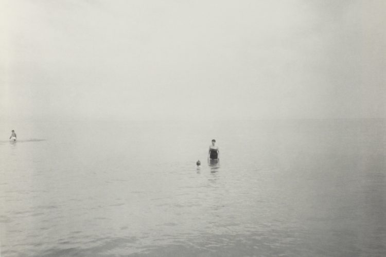 person standing in water at New Jersey beach