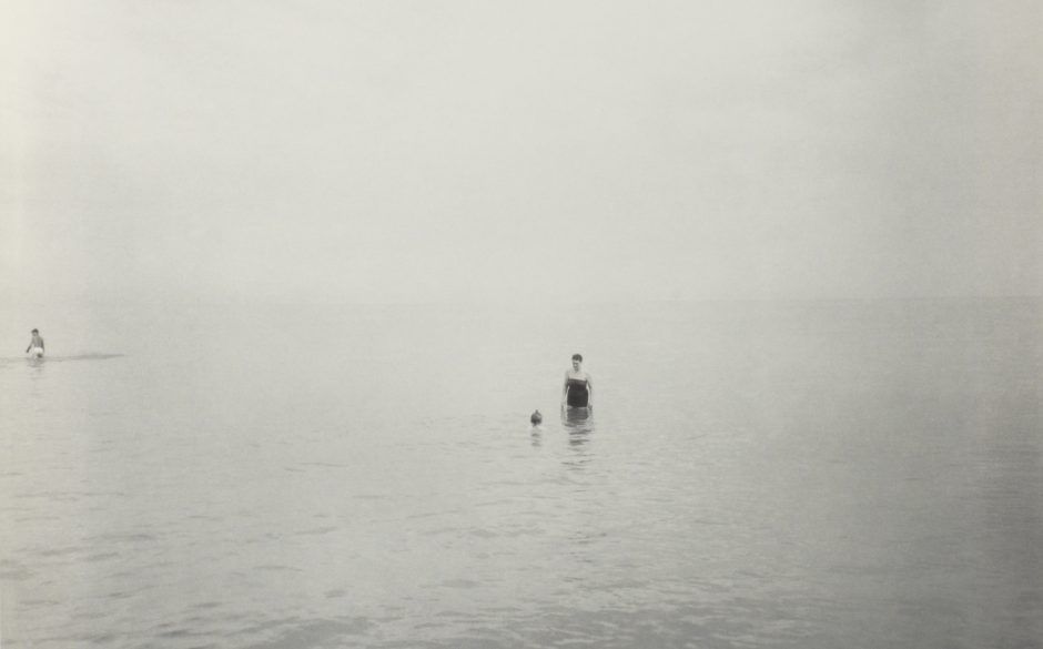 person standing in water at New Jersey beach