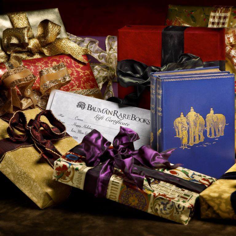 gift certificate surrounded by rare books and gift wrapped items
